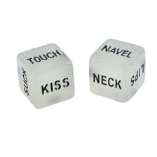 Two translucent glow-in-the-dark dice labeled TOUCH and KISS, and NAVEL and NECK.