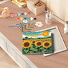 A framed paint by numbers kit featuring a sunflower field and green foliage on canvas.