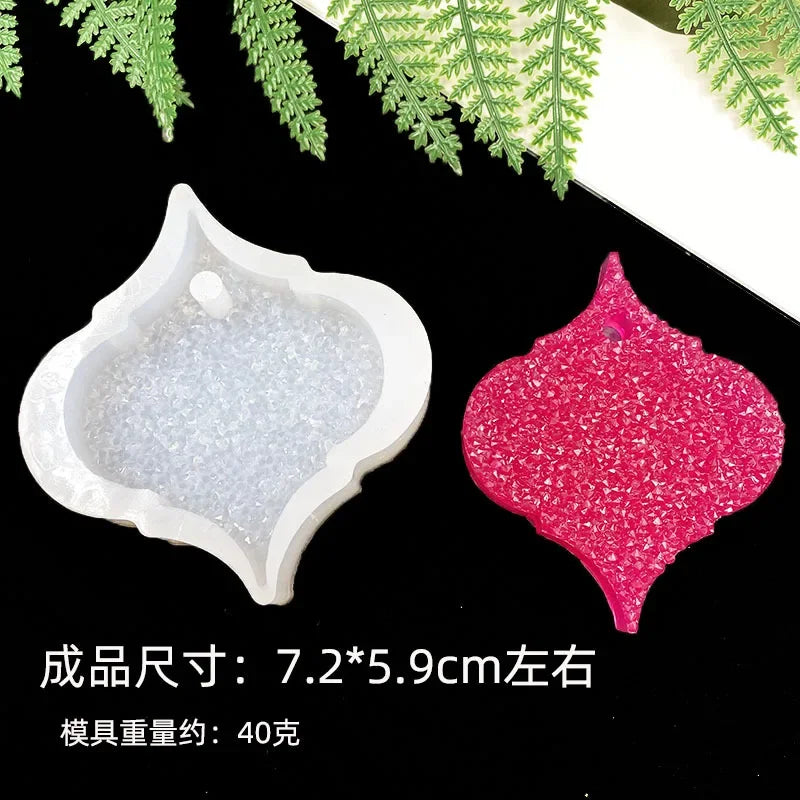 A white silicone resin mold set featuring a heart-shaped mold and a pink glitter mold, set against a dark background.