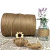 A spool of natural jute twine is shown next to a small bundle and a glass jar.