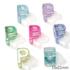 A collection of colorful acrylic letter P beads in various shades including blue, pink, and green.
