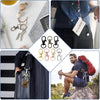 A collection of premium metal swivel snap hooks and key rings displayed on a white surface and attached to a leather bag.