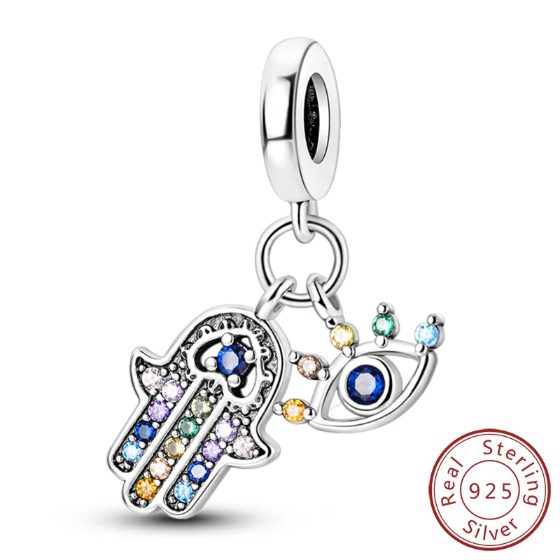 Sterling silver charm beads set featuring cross, angel, and evil eye designs for DIY jewelry making