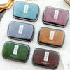 A collection of vintage craft oil-based ink pads in various colors including haze blue, rose dust, lilac purple, ochre yellow