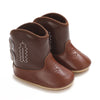 A pair of brown baby western booties with a soft non-slip sole.