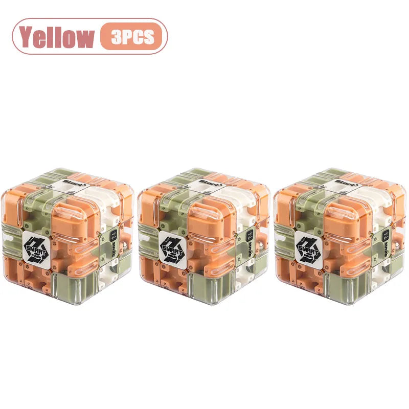 Three pieces of a yellow 3D maze puzzle ball for a brain teaser challenge