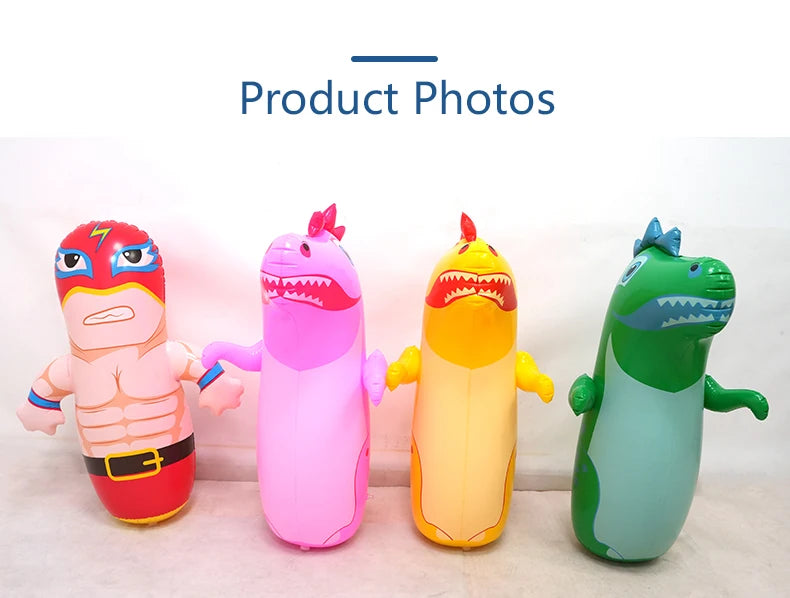 Four inflatable dinosaur punching bag tumbler toys in pink, purple, orange, and green.