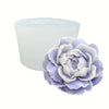 A light purple reusable flower silicone mold with layered petals, shown next to its white, cylindrical base.