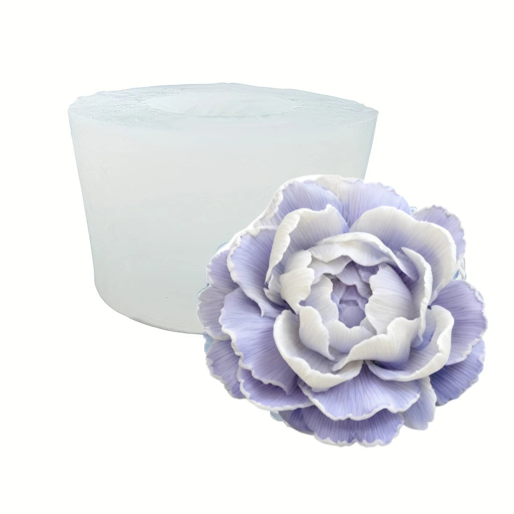 A light purple reusable flower silicone mold with layered petals, shown next to its white, cylindrical base.