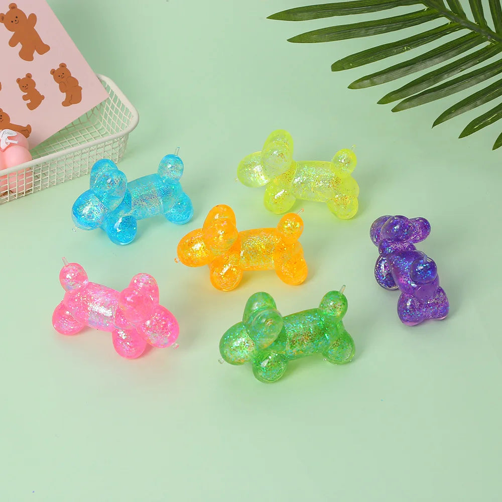 A collection of translucent squishy toys in various colors including blue, yellow, orange, pink, and purple