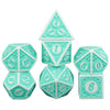 A set of polyhedral dice in a mint green color, including a tetrahedron, octahedron, and dodecahedron.