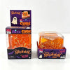 A box of Halloween Nice Cube squishy fidget toy in orange packaging with a glowing cube visible.