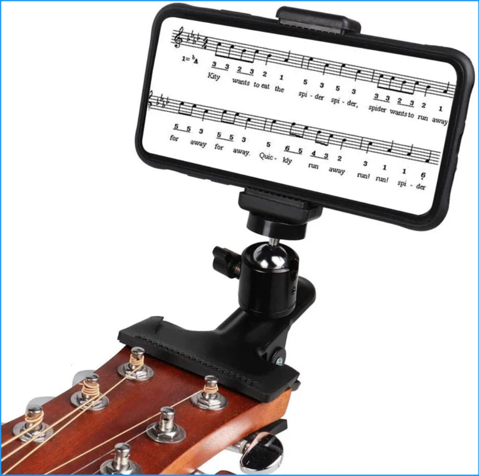 Einstellbarer Handyhalter am Hals einer Akustikgitarre mit musikalischer Staffeldiagramm