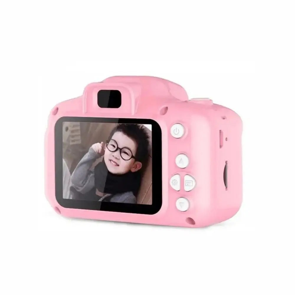 A pink kids mini digital camera with a selfie lens displaying a video.