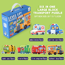 A gift box containing six large block transport puzzles including an ambulance, police car, tank car, train, fire engine, and