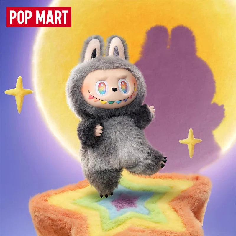 A gray Labubu vinyl plush pendant blind box with large ears and a playful expression, set against a purple background.