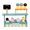 Wooden pretend play ice cream set with colorful scoops displayed on a wooden stand.