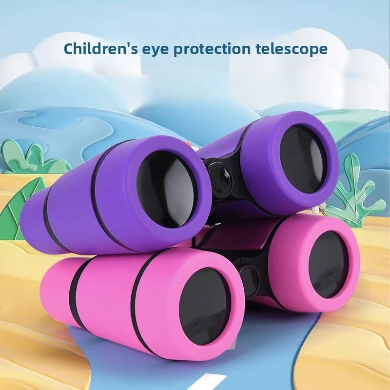A stack of purple and pink children's eye protection telescopes resting on a light blue surface.