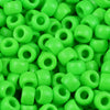 A pile of bright green pony beads for jewelry making and crafts.