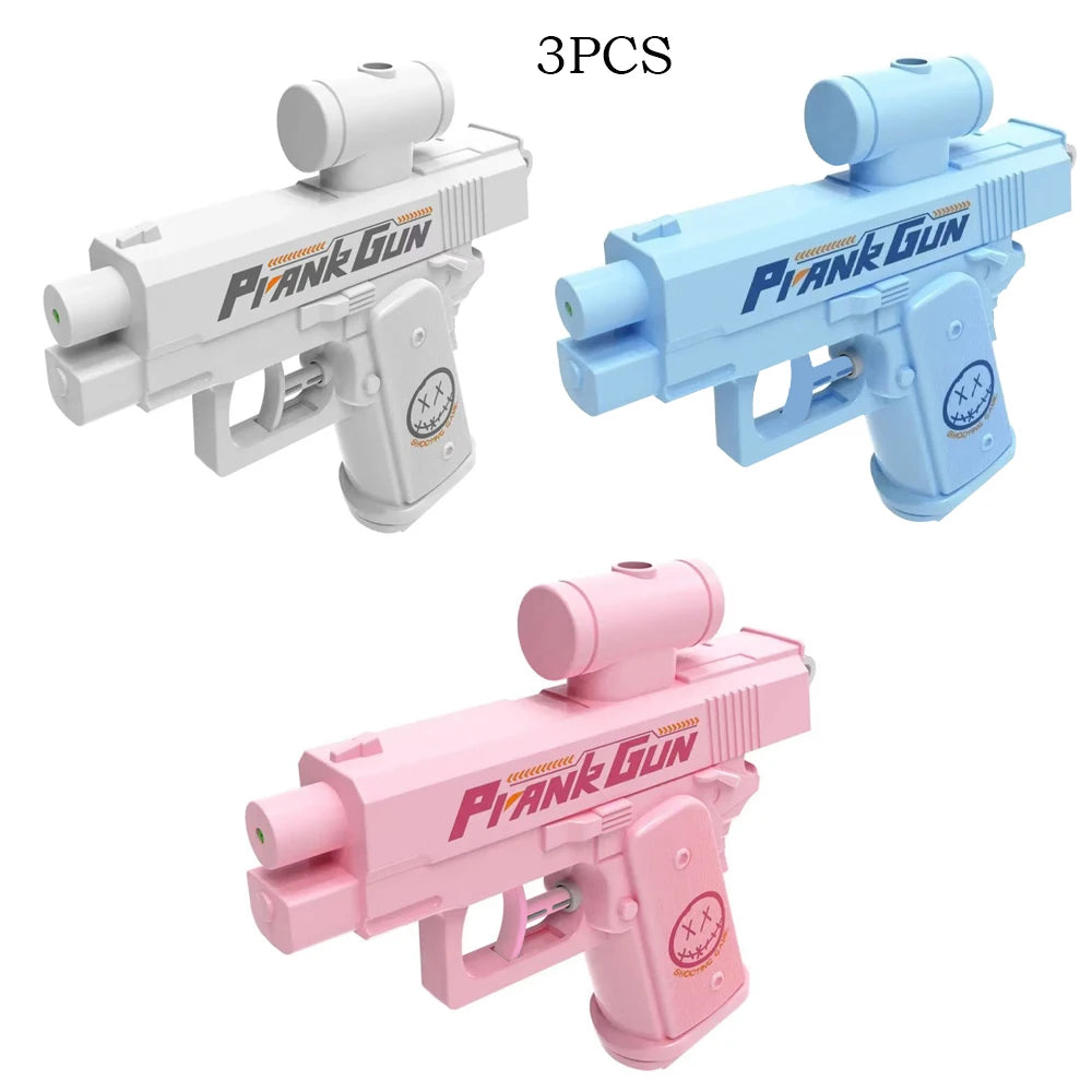 Three versions of a prank gun water toy in white, blue, and pink colors.