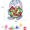 A gray cartoon rabbit holding a dart board with colored targets and several sticky balls.