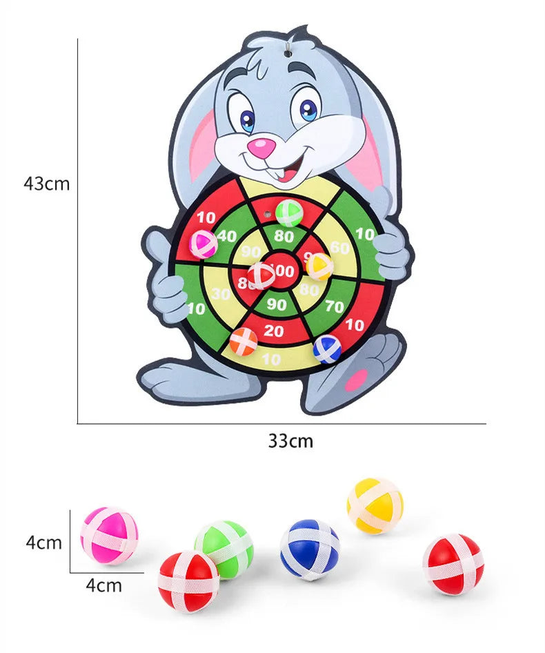 A gray cartoon rabbit holding a dart board with colored targets and several sticky balls.