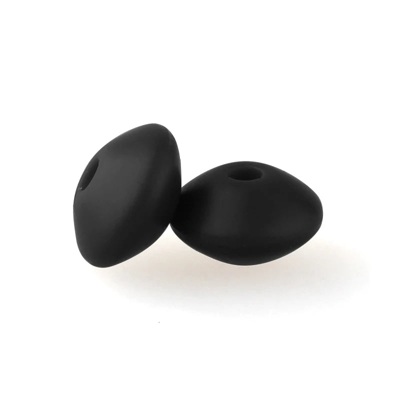 A pair of black silicone lentil beads shaped like an abacus for jewelry making