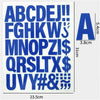 A sheet of blue iron-on heat transfer patches showing the alphabet and symbols in large letters