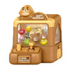 A brown mini claw machine toy for kids with a clear display box and a gift surprise sign.
