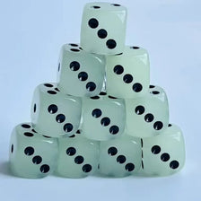 A stack of ten glow-in-the-dark dice in a pale green color, showing black dots.