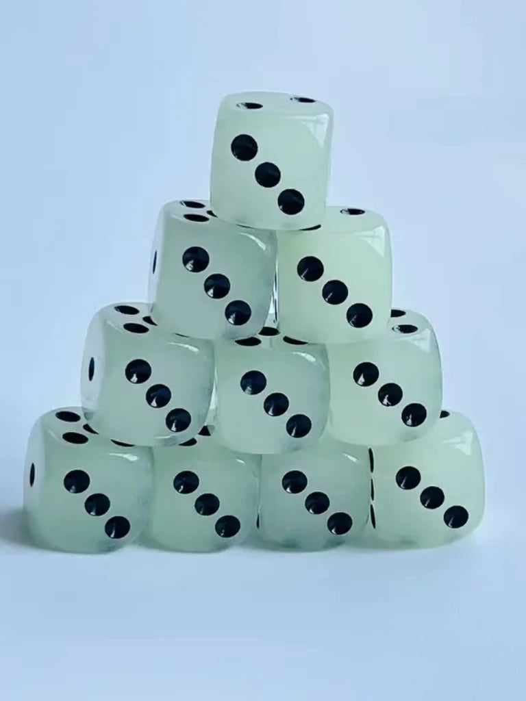 A stack of ten glow-in-the-dark dice in a pale green color, showing black dots.
