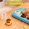 A blue plastic container holds various pretend food items like pudding and fruit on a wooden table.