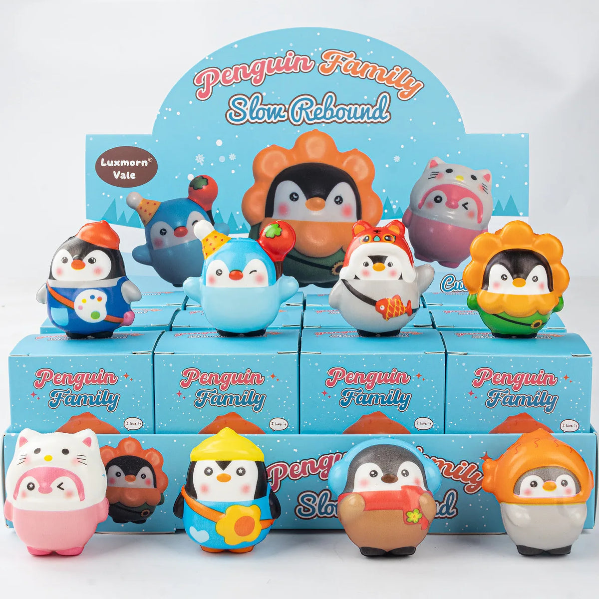 A set of 12 penguin family squishy stress relief toys in various colors and designs.