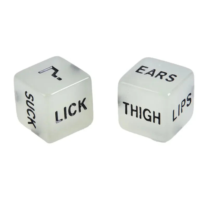 Two translucent dice showing words like SUCK, LICK, EARS, THIGH, and LIPS for a couples' love game