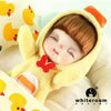 A yellow plush doll with brown hair and orange accents is shown in a close-up against a white background.