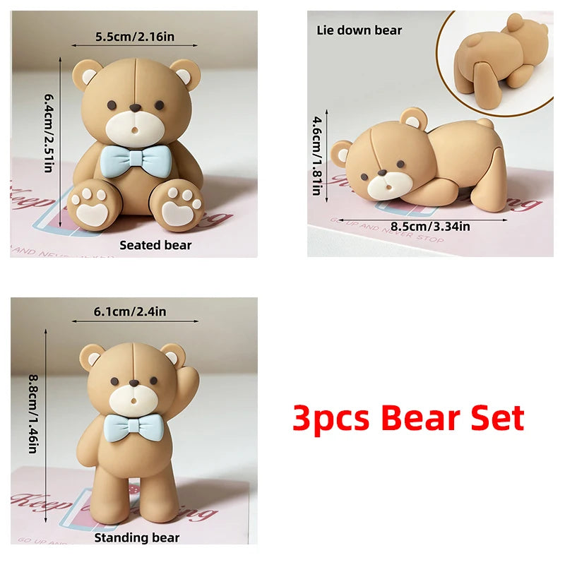 A set of three tan bear figures including a seated, lying down, and standing pose for birthday or baby shower decorations