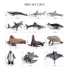 A mini set of 12 realistic ocean animal figurines including a whale, shark, dolphin, turtle, and penguin.