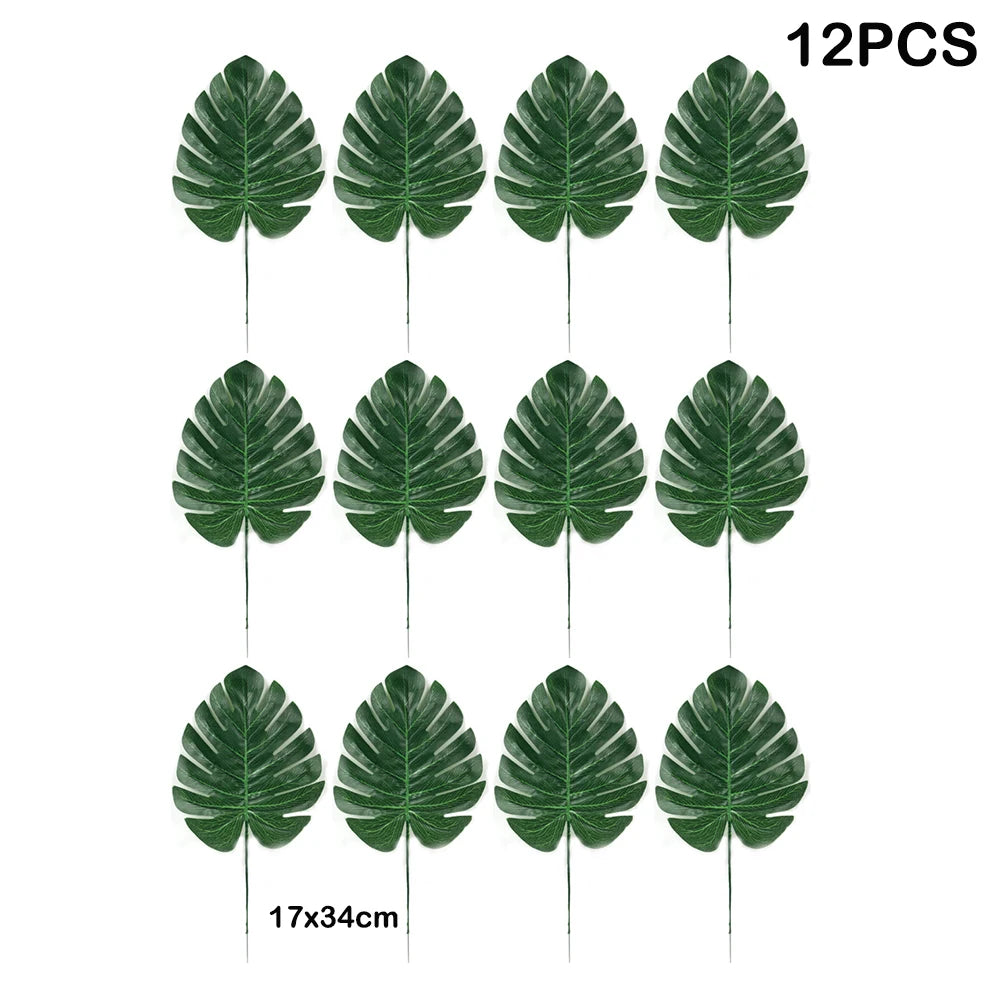 Twelve artificial tropical palm leaves on green stems for party decoration