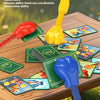 A set of reaction games featuring a cat and mouse theme with various colored plastic toys and cards on a wooden table.