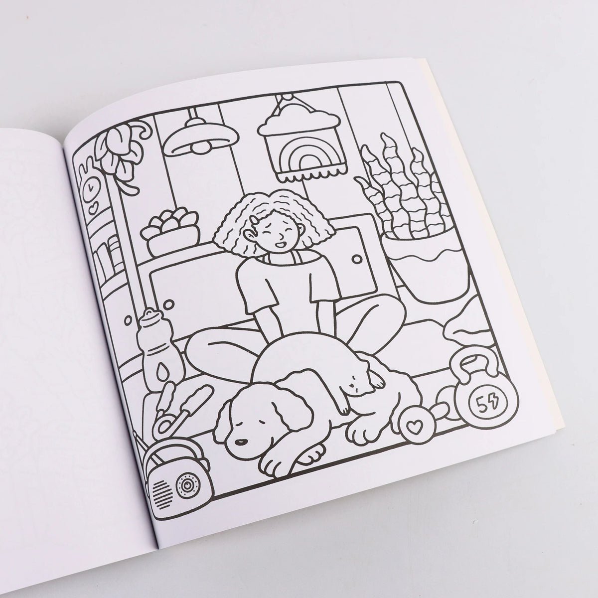 A black and white line drawing of a cozy scene featuring a person, a dog, and various household items like a lamp and a kettl