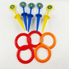 A set of five colored plastic stakes and five rings for a classic ring toss game.