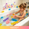 A young girl plays with colorful soft jelly building blocks in a bathtub.