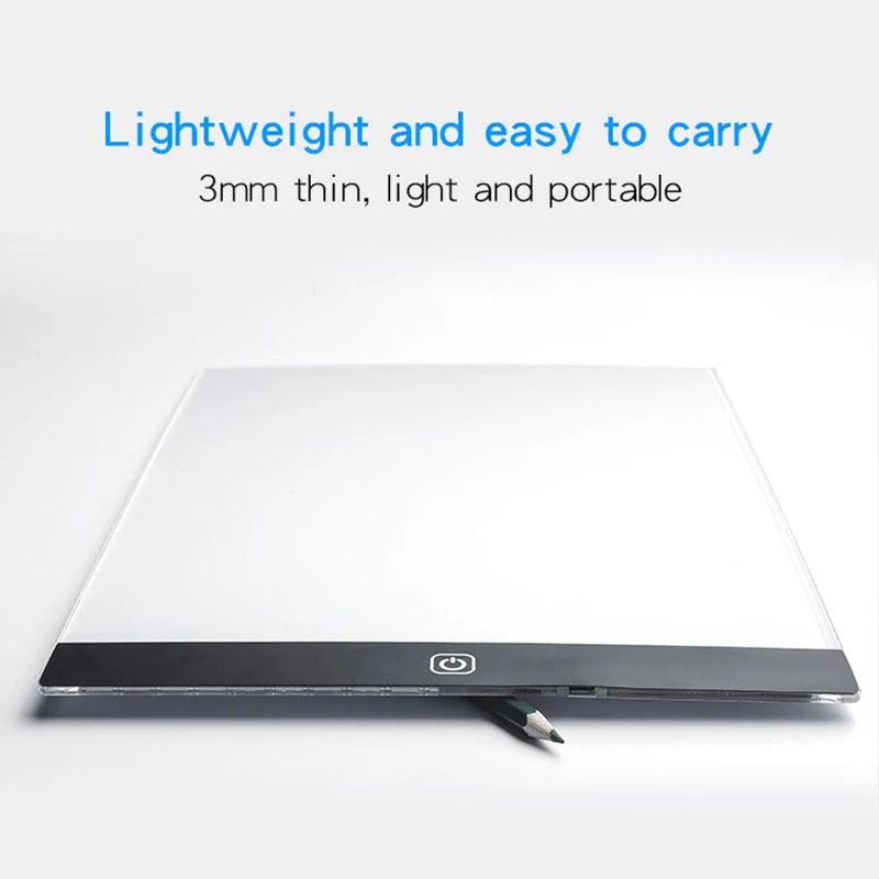 A white LED drawing copy pad with a black frame and a power switch visible on a white background.
