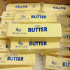 A collection of yellow butter squishy toys packaged in clear plastic bags.