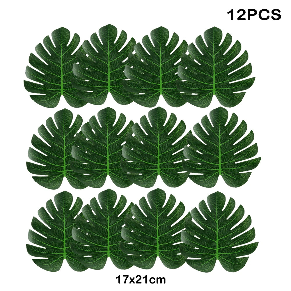 Twelve artificial tropical palm leaves, dark green, measuring 17x21 cm each.