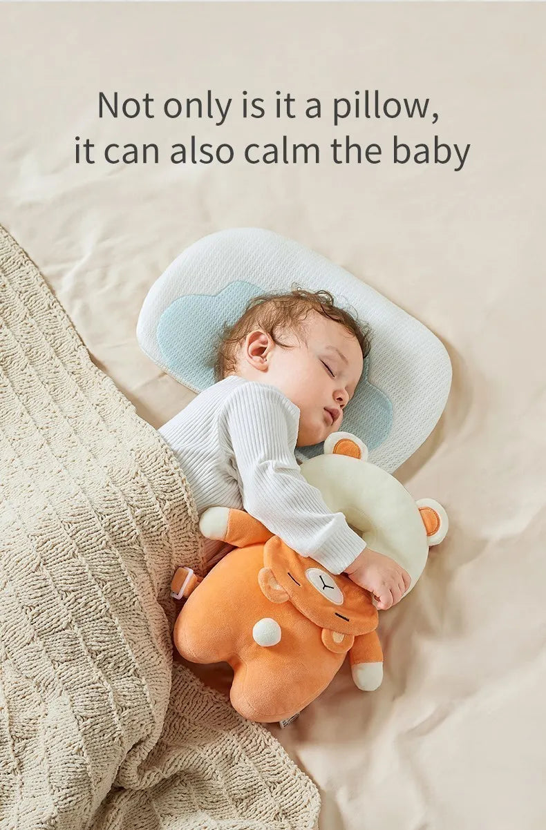 A baby is sleeping peacefully on a soft silicone head protection pillow shaped like a bear.