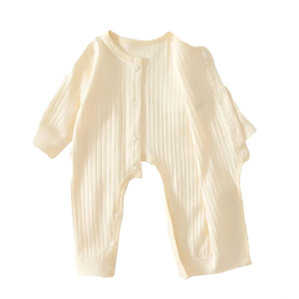 A cream-colored ribbed soft cotton baby romper for newborns and infants.