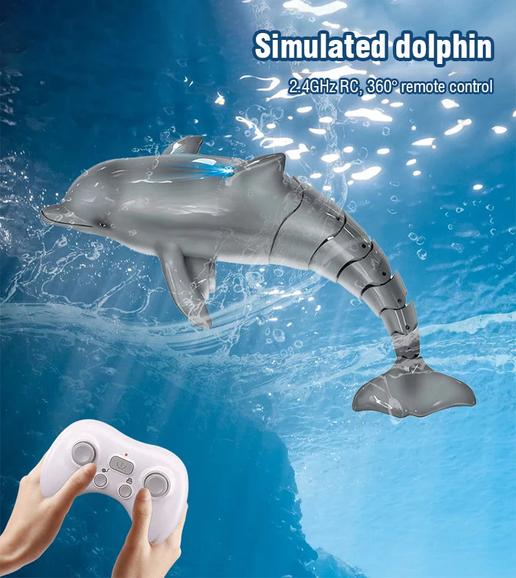 A simulated dolphin toy is shown swimming underwater, controlled by a white remote.