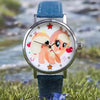 A My Little Pony Magic Sweetheart blind box watch with a pink pony face and blue strap resting on green grass.