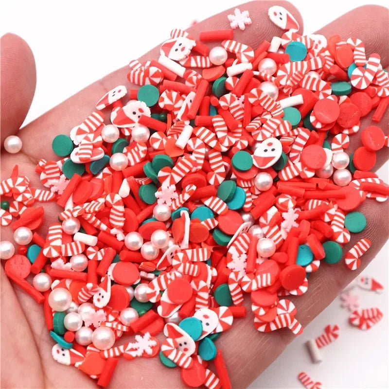 A pile of red and white polymer clay slices assorted for DIY crafts is held in a hand.